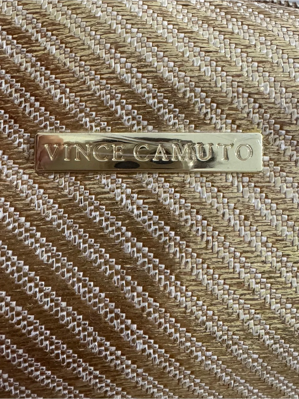 Vince Camuto gold woven canvas metallic cosmetic Bag with starfish Tassel charm.